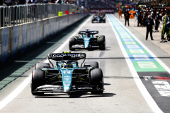 Fernando Alonso, Aston Martin AMR23, and Lance Stroll, Aston Martin AMR23, in the pit lane