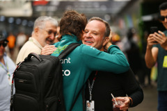 Fernando Alonso, Aston Martin F1 Team, hugs Rubens Barrichello, former Formula One racing driver